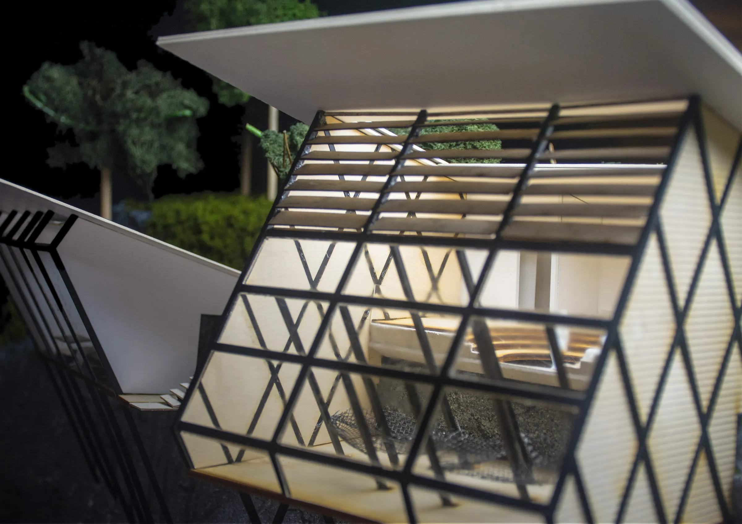 Physical model of a communal glamping lodge situated on the side of a cliff